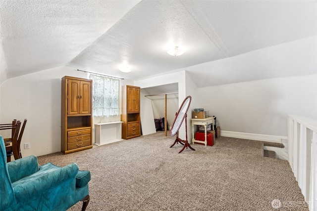 9317 214th Ave E, Bonney Lake, WA 98391 - game room with a textured ceiling, lofted ceiling, and light colored carpet