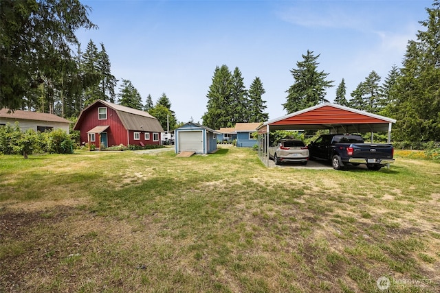 9317 214th Ave E, Bonney Lake, WA 98391 - view of green lawn featuring a carport, an outbuilding, and driveway