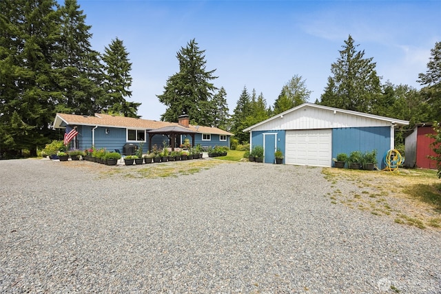9317 214th Ave E, Bonney Lake, WA 98391 - ranch-style house with an outdoor structure, driveway, a detached garage, and a gazebo