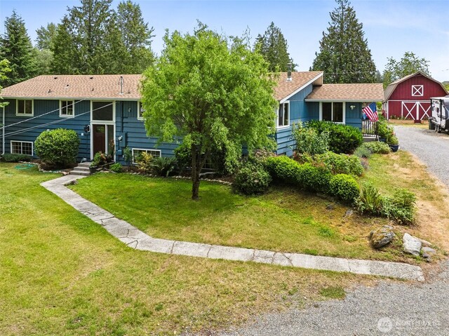9317 214th Ave E, Bonney Lake, WA 98391 - view of front facade featuring a barn, a front lawn, an outdoor structure, and roof with shingles