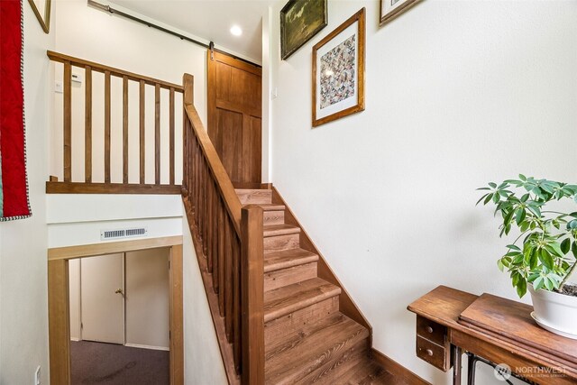 9317 214th Ave E, Bonney Lake, WA 98391 - stairway featuring a barn door and recessed lighting