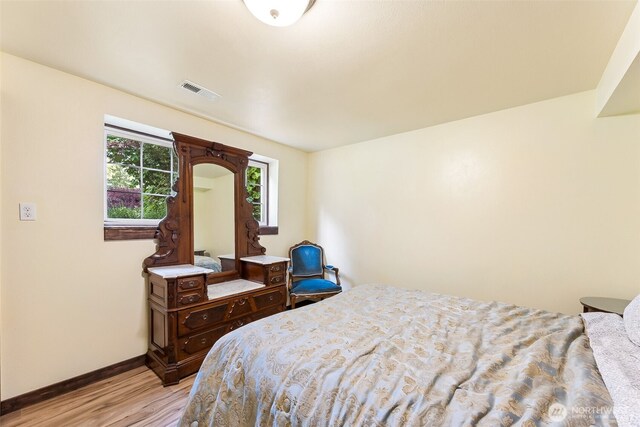 9317 214th Ave E, Bonney Lake, WA 98391 - bedroom featuring light wood-style flooring and baseboards