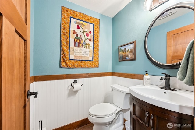 9317 214th Ave E, Bonney Lake, WA 98391 - bathroom featuring wainscoting and vanity