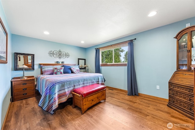 9317 214th Ave E, Bonney Lake, WA 98391 - bedroom featuring wood finished floors and recessed lighting