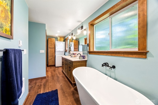9317 214th Ave E, Bonney Lake, WA 98391 - full bathroom with a freestanding bath, wood finished floors, and vanity