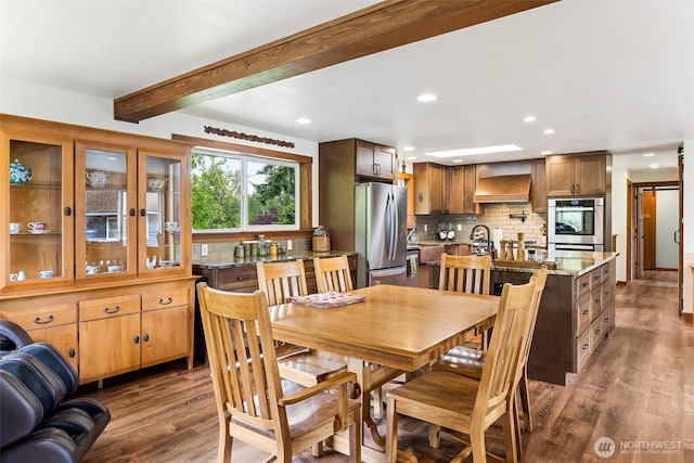 9317 214th Ave E, Bonney Lake, WA 98391 - dining space featuring wood finished floors, recessed lighting, and beamed ceiling