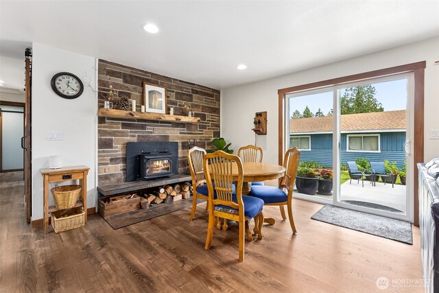 9317 214th Ave E, Bonney Lake, WA 98391 - dining room featuring wood finished floors, recessed lighting, and a wood stove