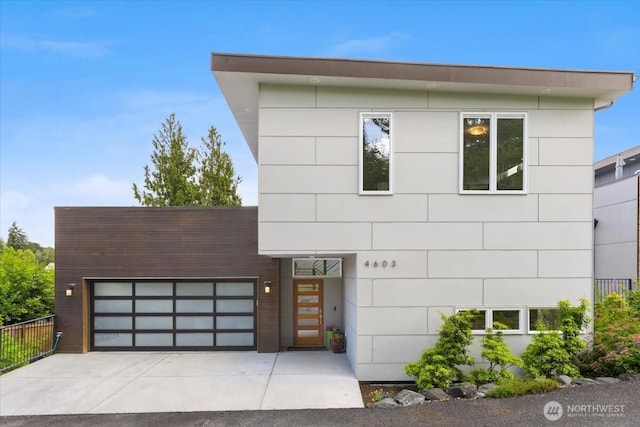 4603 S Juneau St, Seattle, WA 98118 - contemporary house with a garage and concrete driveway