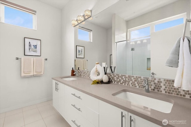 4603 S Juneau St, Seattle, WA 98118 - bathroom featuring tasteful backsplash, a shower stall, double vanity, and tile patterned flooring