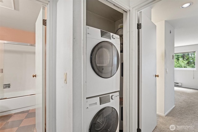 15734 NE 70th Ct Unit 15734, Redmond, WA 98052 - laundry room with stacked washer / drying machine, baseboard heating, carpet floors, and recessed lighting
