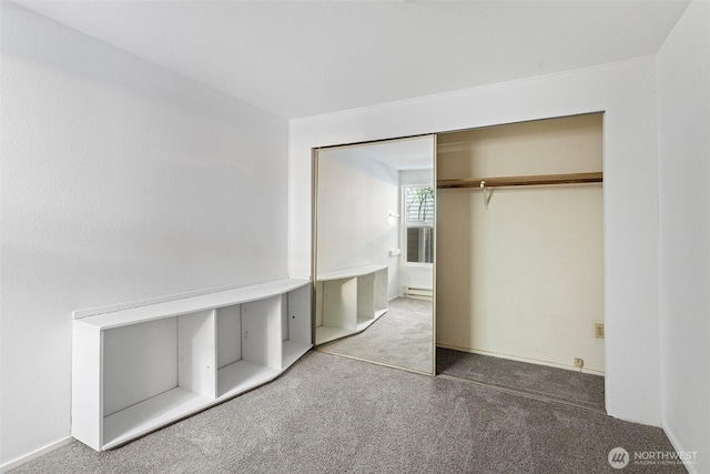15734 NE 70th Ct Unit 15734, Redmond, WA 98052 - unfurnished bedroom featuring carpet floors, a closet, and baseboard heating