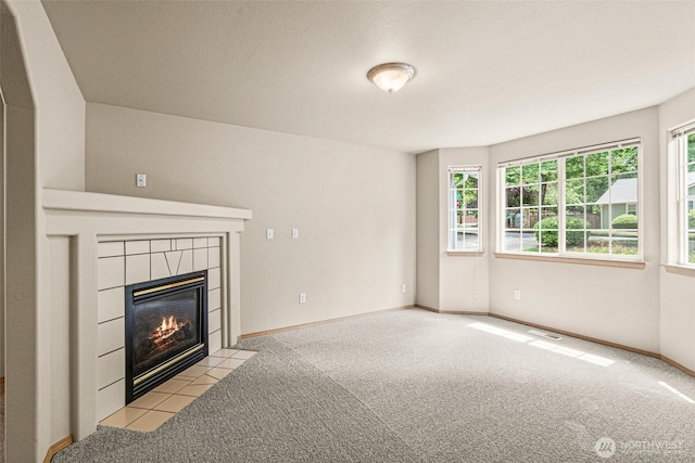 3724 30th Ave SE, Olympia, WA 98501 - unfurnished living room featuring carpet floors and a fireplace