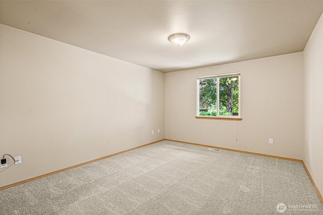 3724 30th Ave SE, Olympia, WA 98501 - empty room featuring light colored carpet and a textured ceiling