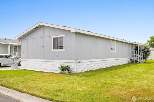 2240 W Broadway Ave Unit 22, Moses Lake, WA 98837 - view of side of home featuring a yard