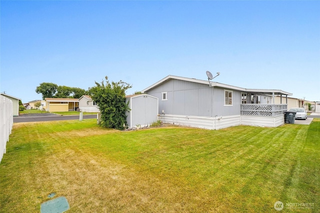 2240 W Broadway Ave Unit 22, Moses Lake, WA 98837 - rear view of property with a yard and a shed