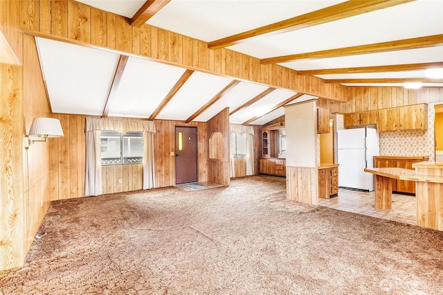 2240 W Broadway Ave Unit 22, Moses Lake, WA 98837 - unfurnished living room featuring light colored carpet and wood walls