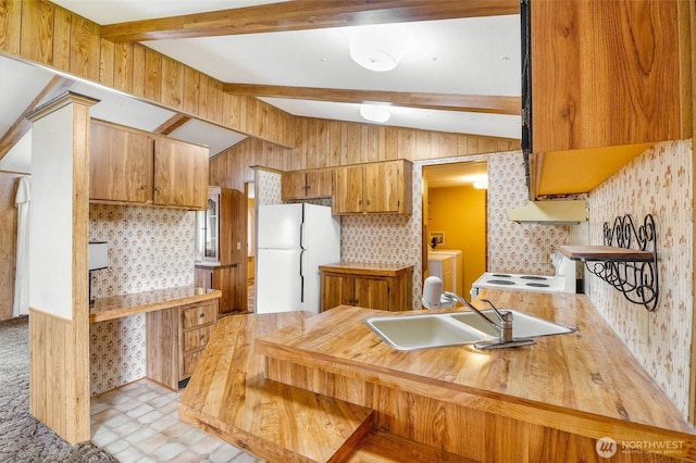 2240 W Broadway Ave Unit 22, Moses Lake, WA 98837 - kitchen with white appliances, brown cabinetry, light countertops, washing machine and clothes dryer, and under cabinet range hood