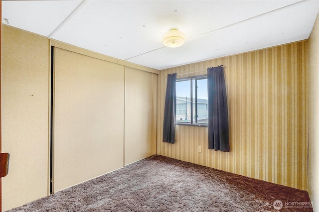 2240 W Broadway Ave Unit 22, Moses Lake, WA 98837 - empty room with carpet flooring and wallpapered walls