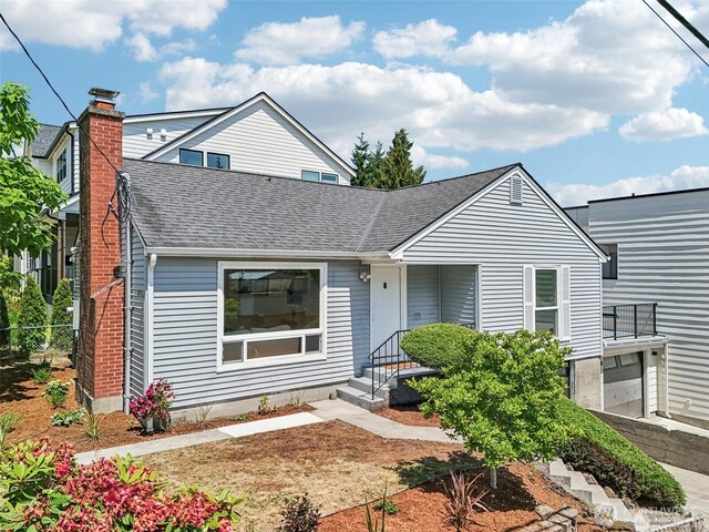 8902 17th Ave NE, Seattle, WA 98115 - bungalow-style home with a shingled roof and a chimney