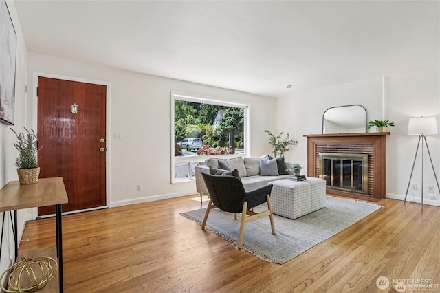 8902 17th Ave NE, Seattle, WA 98115 - living area with light wood-type flooring and a brick fireplace