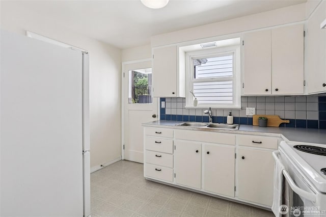 8902 17th Ave NE, Seattle, WA 98115 - kitchen featuring white appliances, decorative backsplash, light flooring, white cabinets, and light countertops