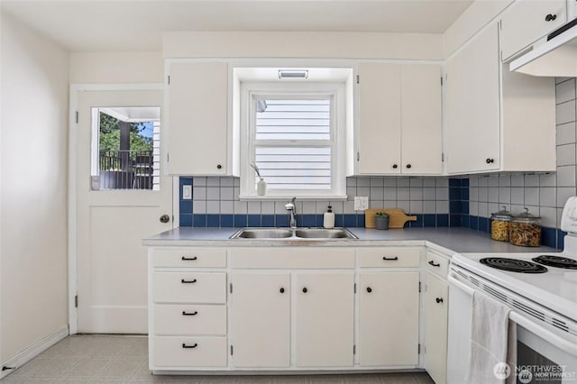 8902 17th Ave NE, Seattle, WA 98115 - kitchen featuring white range with electric cooktop, backsplash, and white cabinets