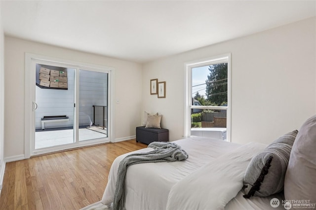 8902 17th Ave NE, Seattle, WA 98115 - bedroom with access to outside and wood finished floors