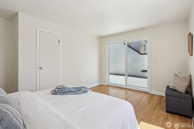 8902 17th Ave NE, Seattle, WA 98115 - bedroom featuring access to exterior and light wood-type flooring