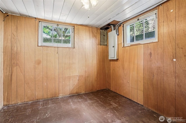 8902 17th Ave NE, Seattle, WA 98115 - basement with tile patterned floors, wooden walls, plenty of natural light, and electric panel