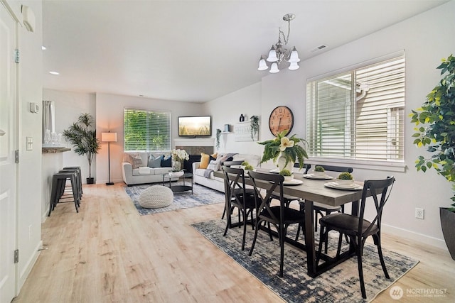 1341 52nd St NE Unit 1205, Auburn, WA 98002 - dining area with light wood-style floors, a chandelier, and recessed lighting
