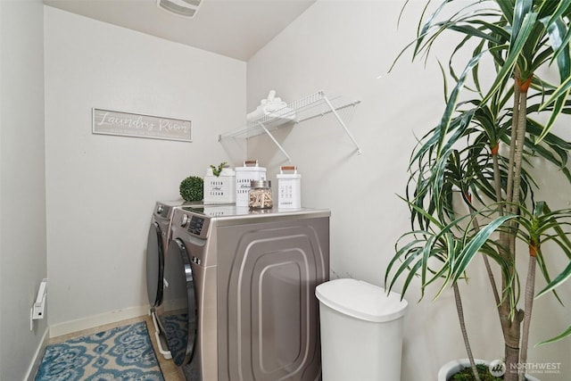 1341 52nd St NE Unit 1205, Auburn, WA 98002 - laundry room featuring washing machine and clothes dryer and baseboards