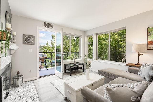 29 Etruria St Unit B505, Seattle, WA 98109 - living room with plenty of natural light, wood finished floors, and a tile fireplace