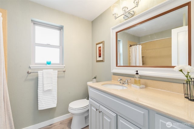29 Etruria St Unit B505, Seattle, WA 98109 - bathroom featuring vanity, wood finished floors, and curtained shower