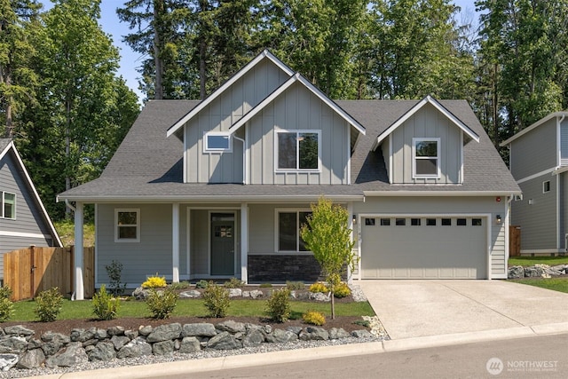 1142 Brookstone Dr, Bellingham, WA 98229 - craftsman house featuring board and batten siding, covered porch, concrete driveway, and roof with shingles
