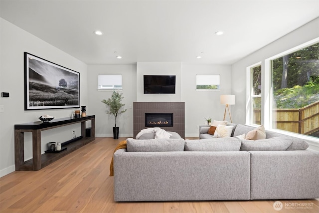 1142 Brookstone Dr, Bellingham, WA 98229 - living area with light wood finished floors, recessed lighting, healthy amount of natural light, and a glass covered fireplace