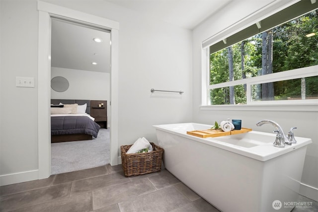 1142 Brookstone Dr, Bellingham, WA 98229 - bathroom featuring a freestanding bath and tile patterned floors
