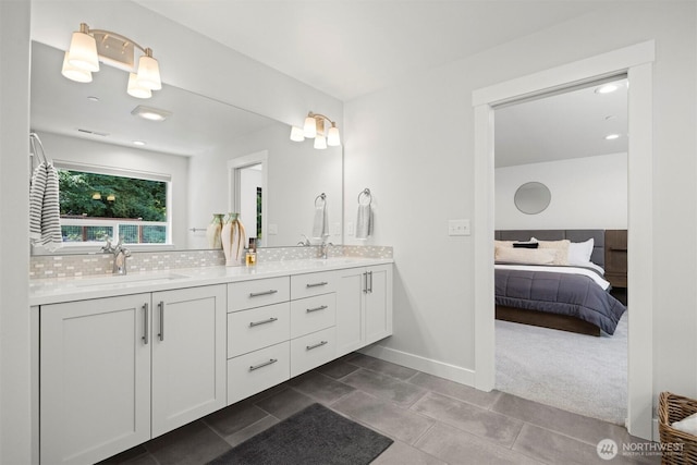 1142 Brookstone Dr, Bellingham, WA 98229 - ensuite bathroom with double vanity, decorative backsplash, and tile patterned floors