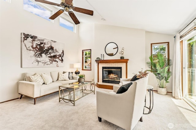 722 N 85th St Unit 41, Seattle, WA 98103 - living room with healthy amount of natural light, carpet flooring, a fireplace, ceiling fan, and high vaulted ceiling