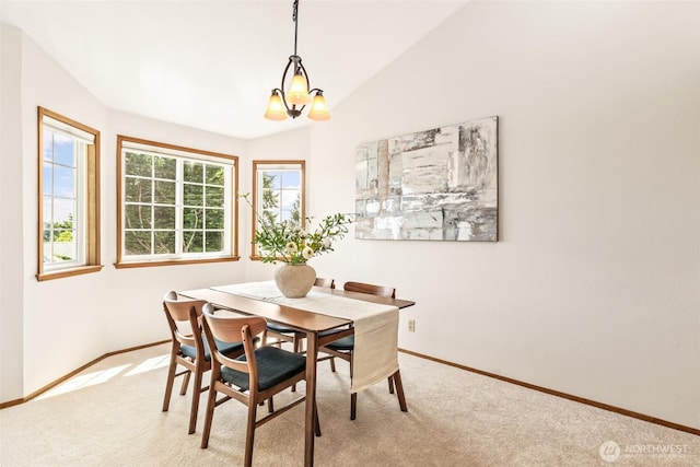 722 N 85th St Unit 41, Seattle, WA 98103 - dining area with lofted ceiling, light carpet, and a chandelier