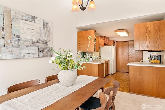 722 N 85th St Unit 41, Seattle, WA 98103 - dining room featuring a chandelier