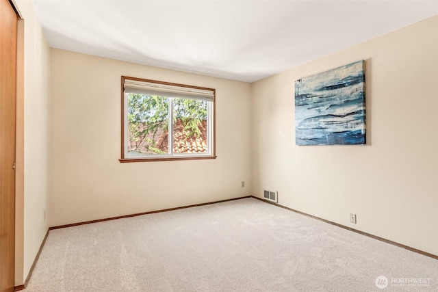 722 N 85th St Unit 41, Seattle, WA 98103 - empty room featuring carpet flooring and baseboards