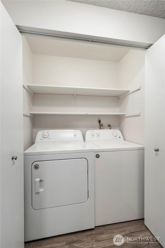 3834 D Pl SE, Auburn, WA 98002 - laundry room featuring washer and dryer and wood finished floors