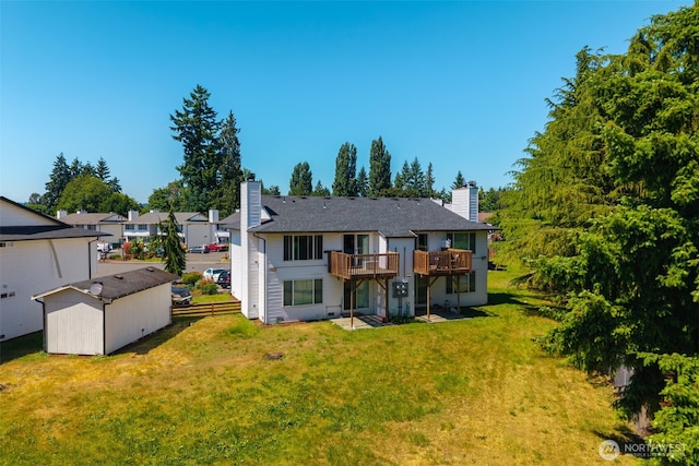 3834 D Pl SE, Auburn, WA 98002 - back of house featuring a chimney, a yard, and a wooden deck