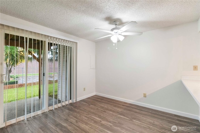 3834 D Pl SE, Auburn, WA 98002 - unfurnished room featuring ceiling fan, dark wood-style floors, and a textured ceiling