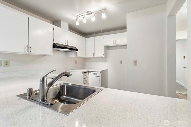 3834 D Pl SE, Auburn, WA 98002 - kitchen with under cabinet range hood, white cabinetry, and light countertops