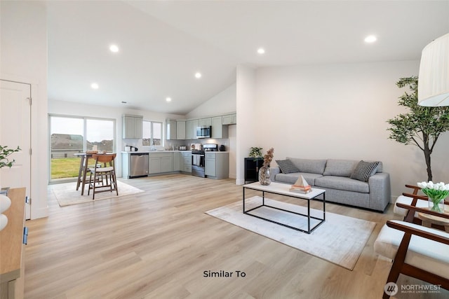 314 N Sandy Loop, Moses Lake, WA 98837 - living area featuring light wood finished floors, recessed lighting, and high vaulted ceiling