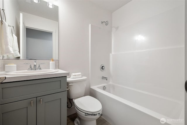 314 N Sandy Loop, Moses Lake, WA 98837 - bathroom featuring vanity, shower / bathtub combination, and decorative backsplash