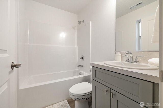 314 N Sandy Loop, Moses Lake, WA 98837 - full bathroom featuring vanity,  shower combination, and wood finished floors