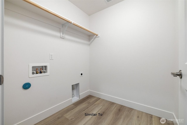 314 N Sandy Loop, Moses Lake, WA 98837 - washroom with hookup for a washing machine, light wood finished floors, and electric dryer hookup