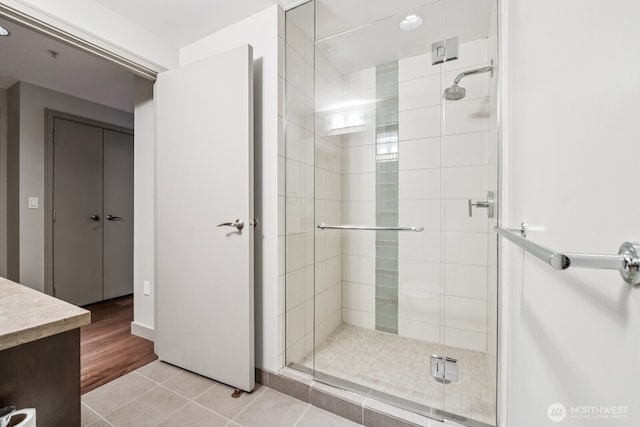 10610 NE 9th Pl Unit C4210, Bellevue, WA 98004 - full bath with a shower stall, vanity, tile patterned flooring, and recessed lighting